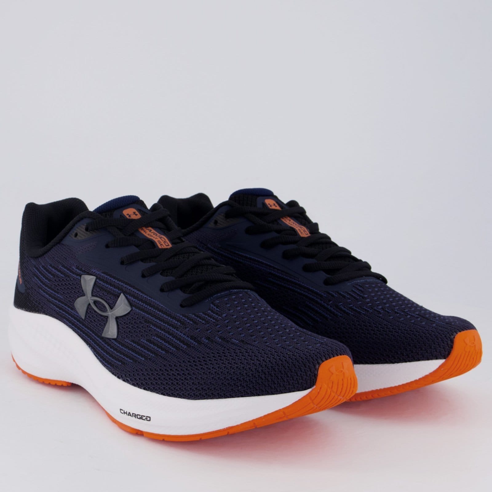 Vista 2 Tênis Under Armour Charged Starlight SE Marinho e Laranja Under Armour azul marinho