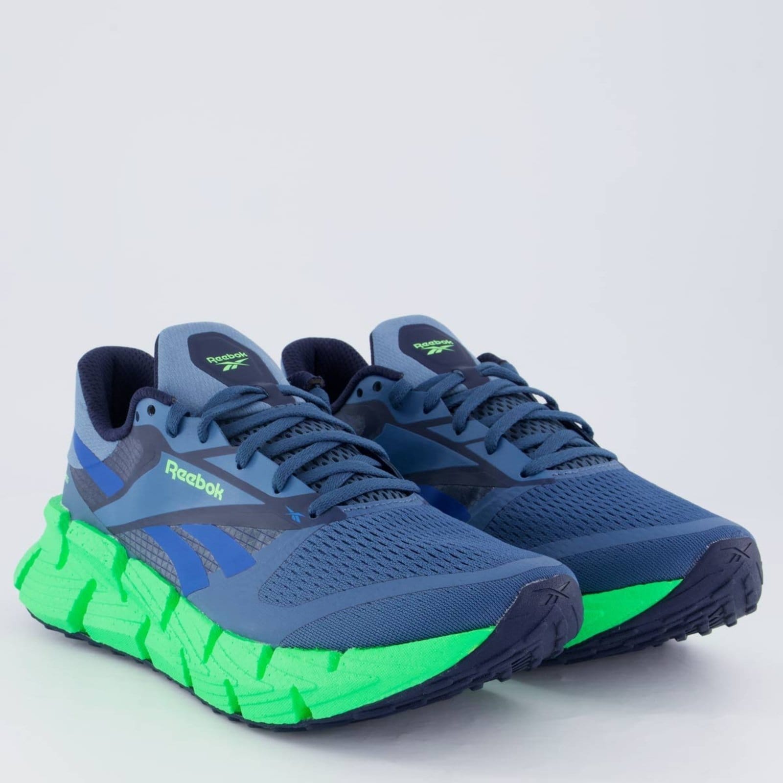 Vista 2 Tênis Reebok Floatzig 1 Marinho e Verde Reebok azul marinho verde