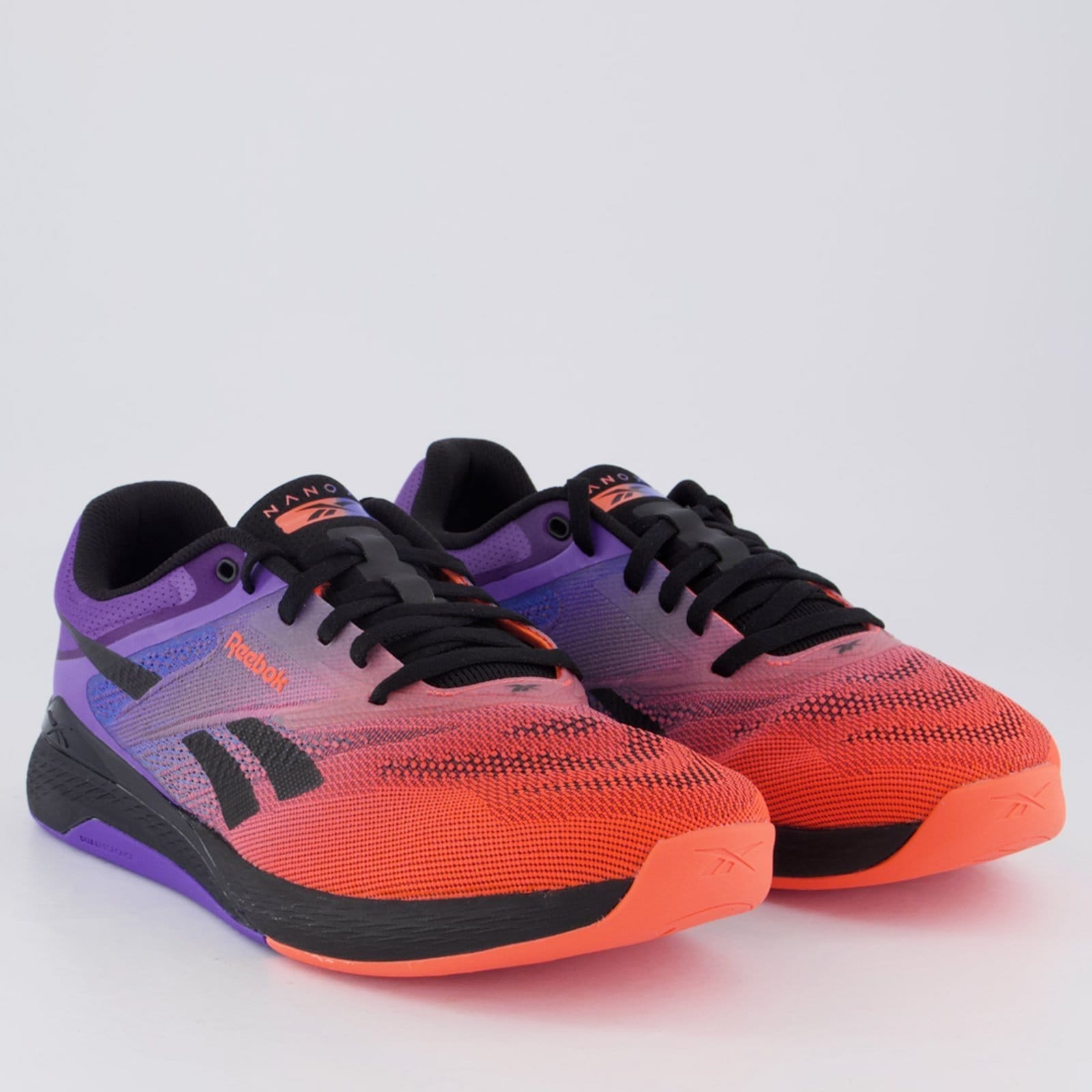 Vista 2 Tênis Reebok Nano X5 e Laranja Reebok roxo