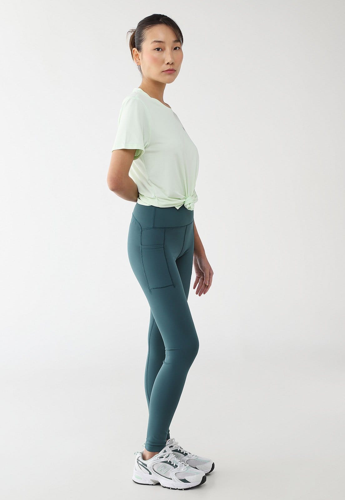 Vista 2 Legging Feminina New Balance RC Pocket 25 New Balance verde