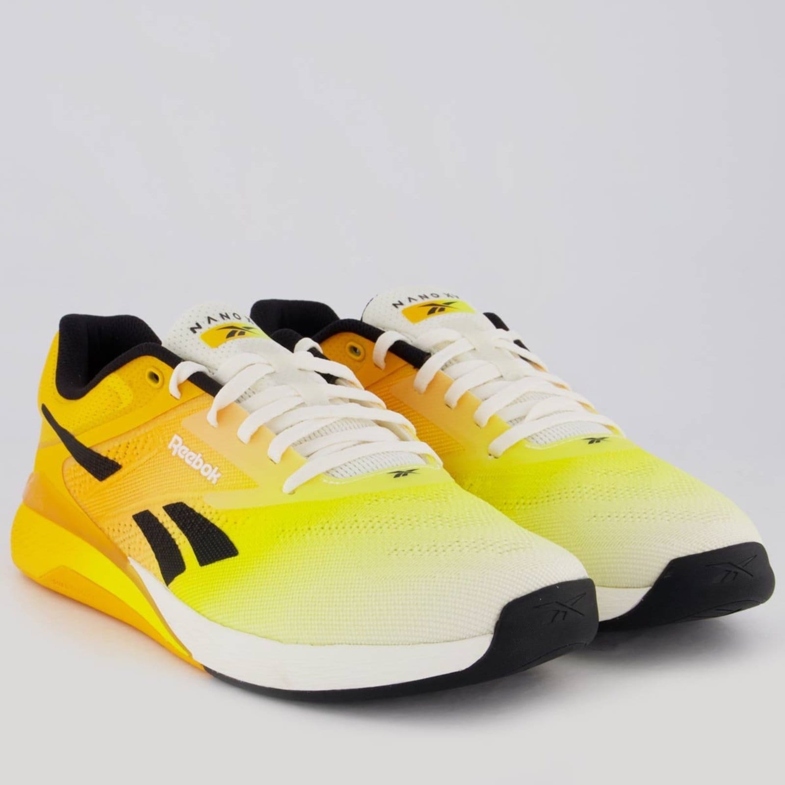 Vista 2 Tênis Reebok Nano X5 Amarelo e Reebok laranja
