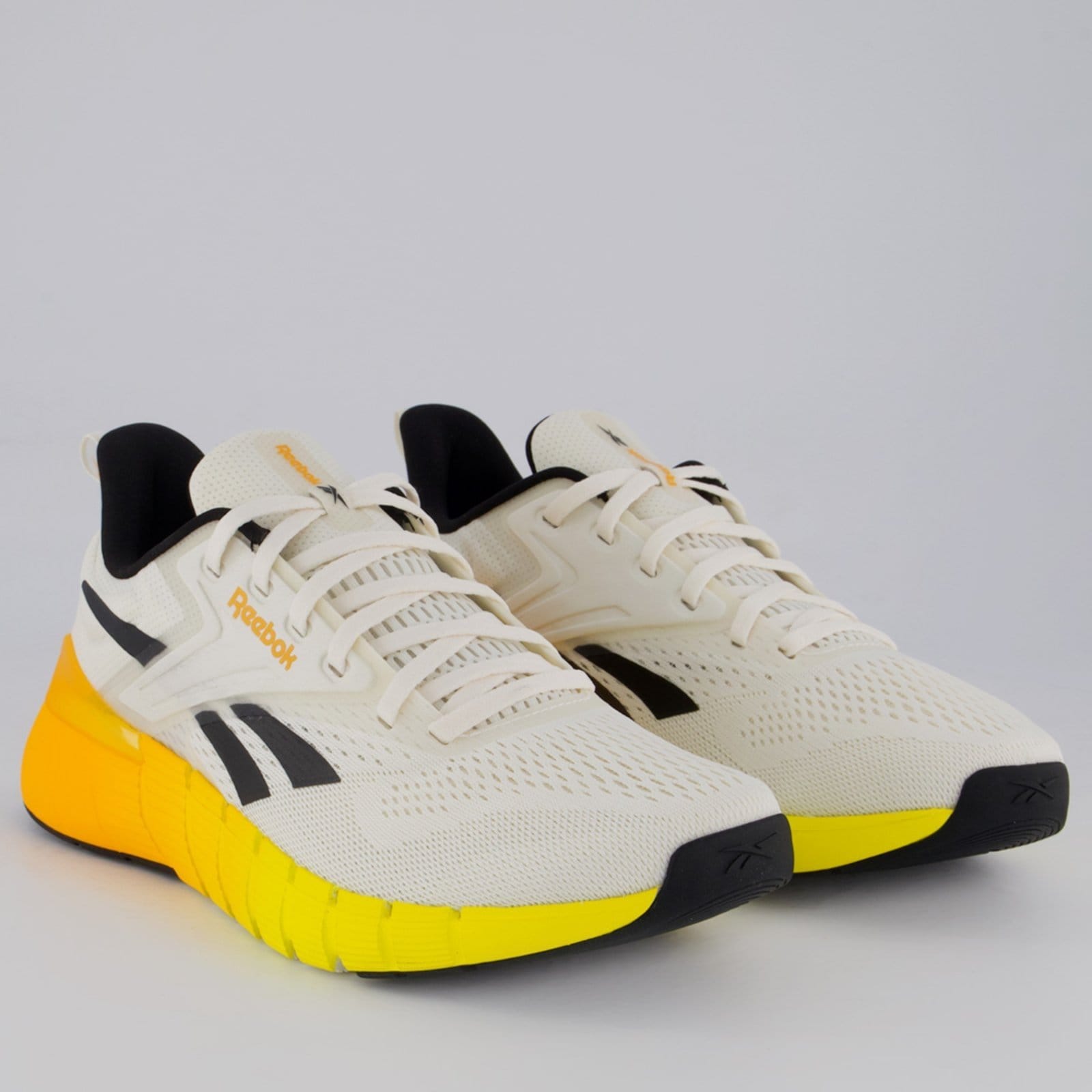 Vista 2 Tênis Reebok Nano Gym e Amarelo Reebok branco